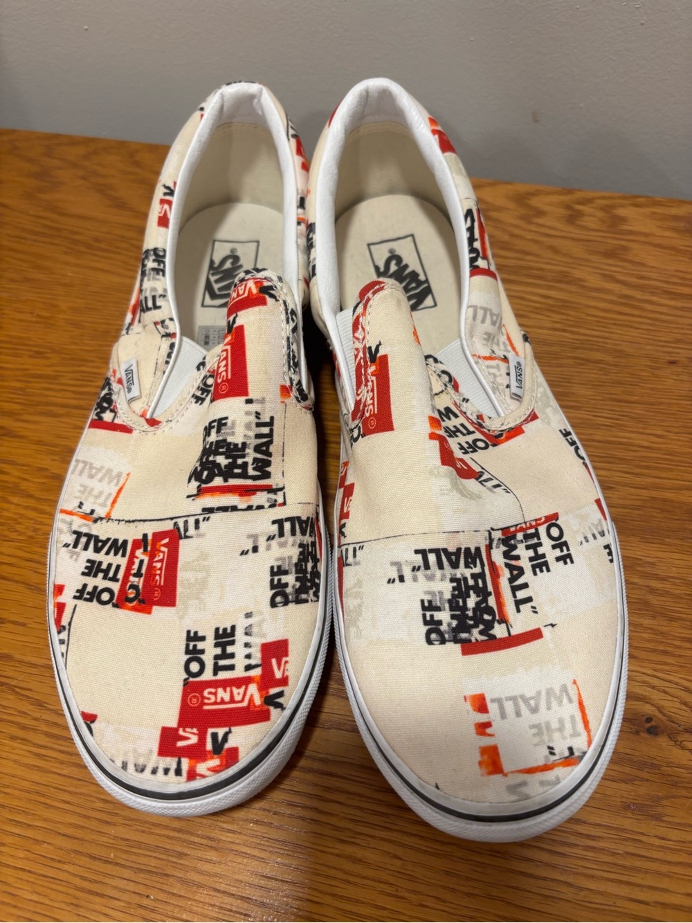 Vans Slip-On Loafers in White with Red and Black Graphic